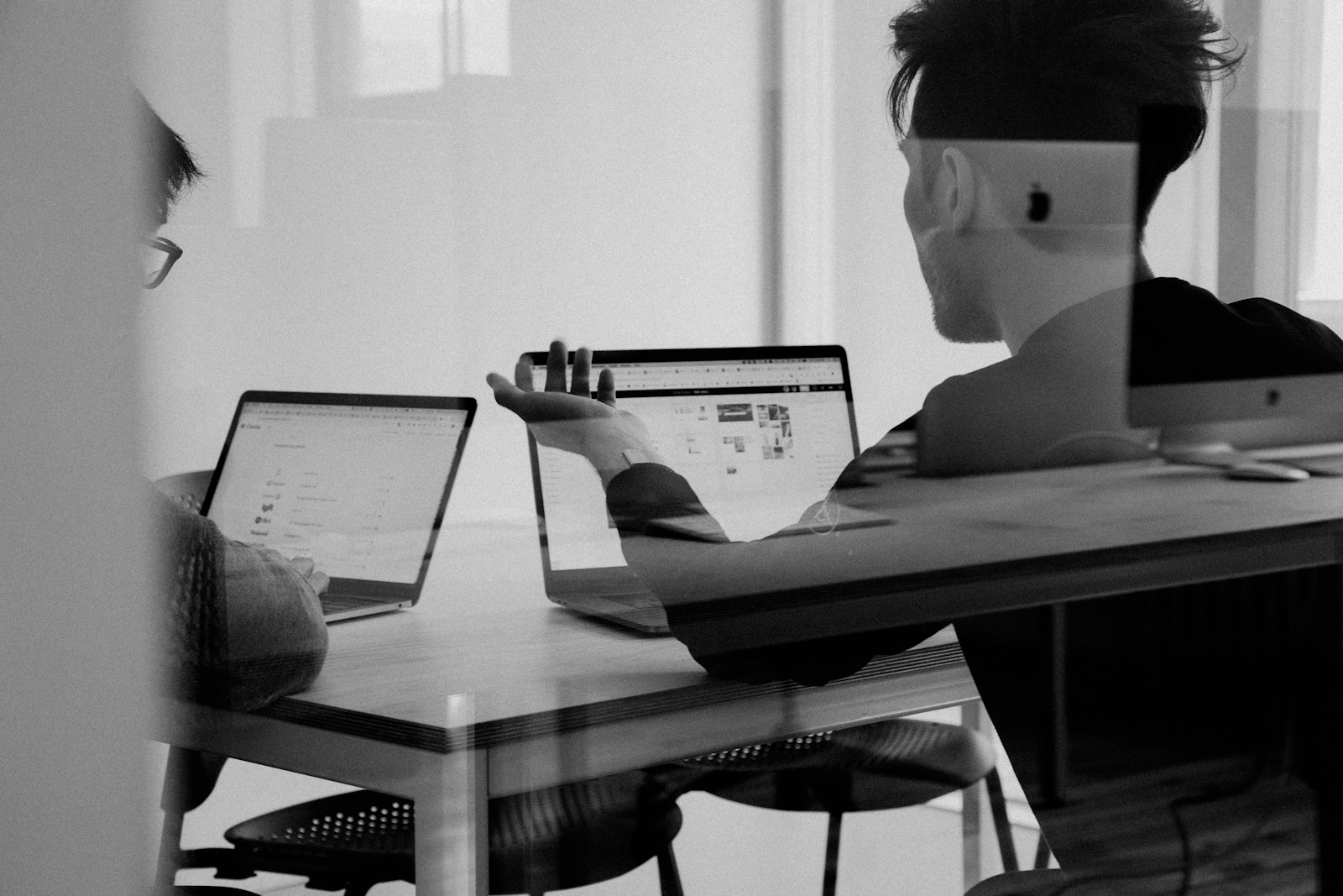 Paid media planning on a desk with laptop and notes at the SweeCrimeM studio